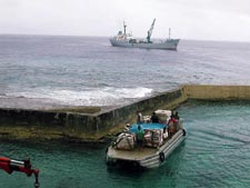 Barging cargo ashore from the MV Miss Mataroa